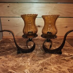 Vintage pair of amber cast iron candle holders